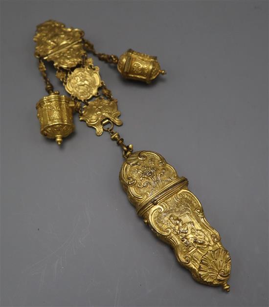 An 18th century English rococo gilt metal chatelaine, with two thimble cases and etui case